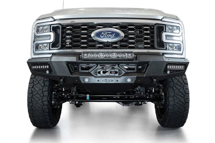 White Ford Superduty truck's front end showcasing the ADD F810335070103 black Phantom winch bumper, model years 2023-2024