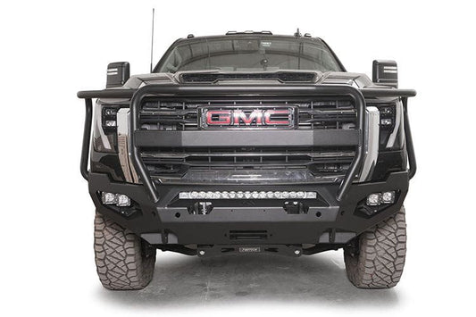 Front view of a black GMC truck featuring the Fab Fours Matrix bumper, winch-ready with a full guard design.