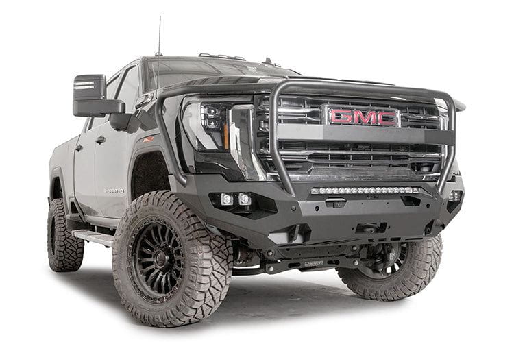 Front view of a black GMC truck featuring the Fab Fours Matrix bumper, winch-ready with a full guard design.