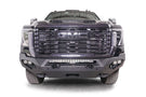 Front view of a black GMC Sierra 2500/3500 truck featuring a large grille and Fab Fours Matrix front bumper, winch ready.