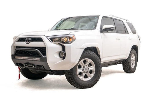 White Toyota truck with a Fab Fours hidden front bumper pre-runner and winch guard, suitable for 2014-2024 4Runners.