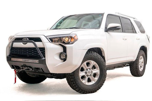 White Toyota 4Runner front end with a Fab Fours hidden bumper high guard, designed for winching and rugged terrain.