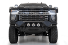 Front view of a black Chevy truck featuring a large ADD F270014100103 Bomber Black front bumper, designed for Silverado 2500/3500 model