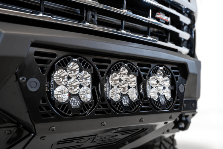 Front view of a black Chevy truck featuring a large ADD F270014100103 Bomber Black front bumper, designed for Silverado 2500/3500 model