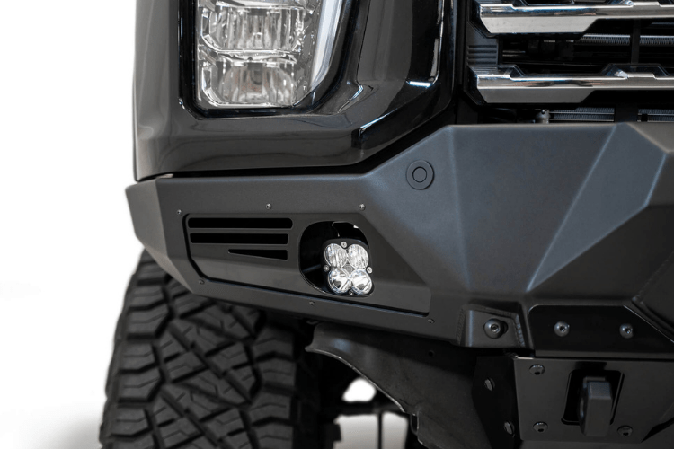 Front view of a black Chevy truck featuring a large ADD F270014100103 Bomber Black front bumper, designed for Silverado 2500/3500 model