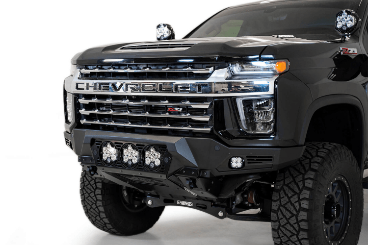 Front view of a black Chevy truck featuring a large ADD F270014100103 Bomber Black front bumper, designed for Silverado 2500/3500 model