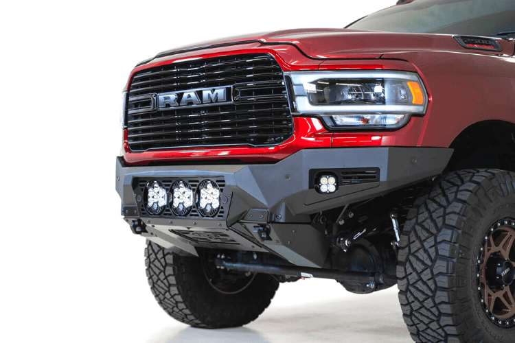 A red Ram truck's front end showcasing the ADD F560014100103 Bomber Black bumper, designed for Dodge Ram 2019-2023 models