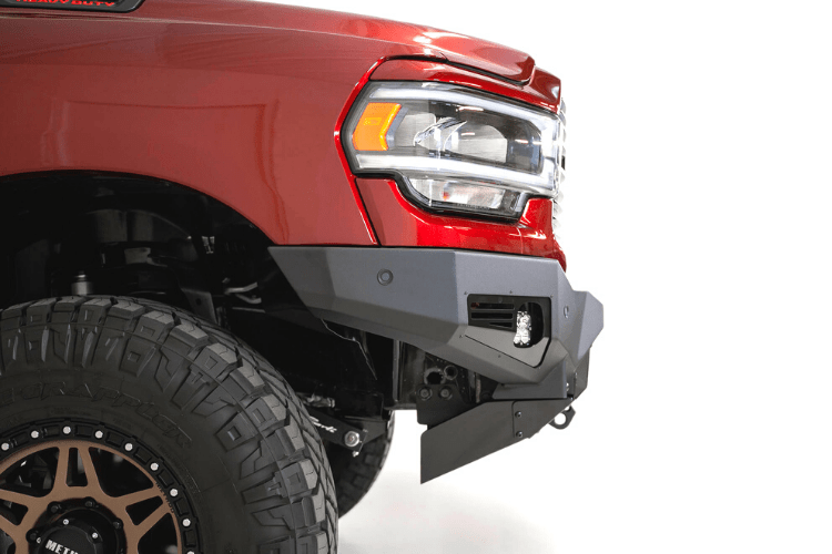 A red Ram truck's front end showcasing the ADD F560014100103 Bomber Black bumper, designed for Dodge Ram 2019-2023 models