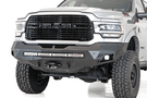 A white Dodge Ram 2500/3500 truck featuring a prominent ADD Stealth Fighter front bumper and winch mount, F561423030103