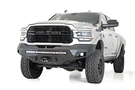 A white Dodge Ram 2500/3500 truck featuring a prominent ADD Stealth Fighter front bumper and winch mount, F561423030103