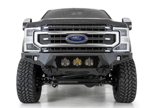 Black Ford truck's front end showcasing an ADD Bomber Black bumper F160014100103, tailored for 2017-2022 F250/F350 Superduty vehicles