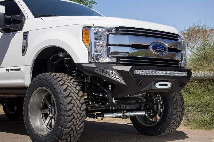 Front view of a White Ford F250/F350 Superduty truck featuring a black ADD F161202860103 Stealth Fighter bumper with a light bar, winch ready