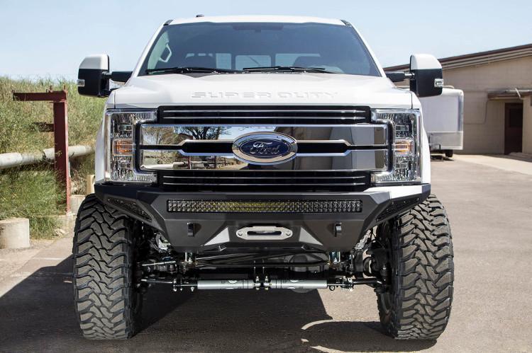 Front view of a White Ford F250/F350 Superduty truck featuring a black ADD F161202860103 Stealth Fighter bumper with a light bar, winch ready