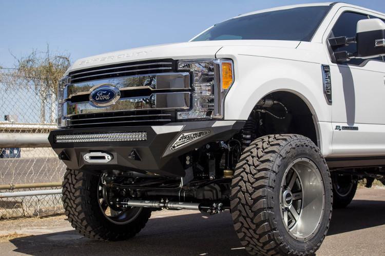 Front view of a White Ford F250/F350 Superduty truck featuring a black ADD F161202860103 Stealth Fighter bumper with a light bar, winch ready