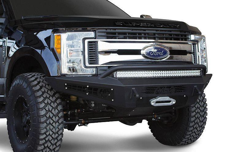 Black Ford F250/F350 Superduty pickup truck equipped with ADD Honeybadger front bumper F167382840103, suitable for winches and additional light mounts