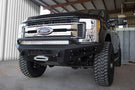 Black Ford F250/F350 Superduty pickup truck equipped with ADD Honeybadger front bumper F167382840103, suitable for winches and additional light mounts