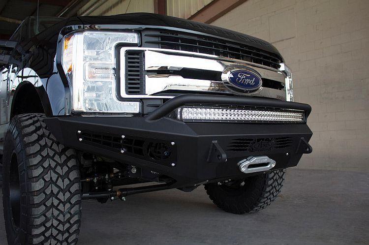 Black Ford F250/F350 Superduty pickup truck equipped with ADD Honeybadger front bumper F167382840103, suitable for winches and additional light mounts