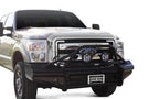 A black Ford Super Duty truck with a Ranch Hand Legend BullNose Series front bumper showcasing its robust design.